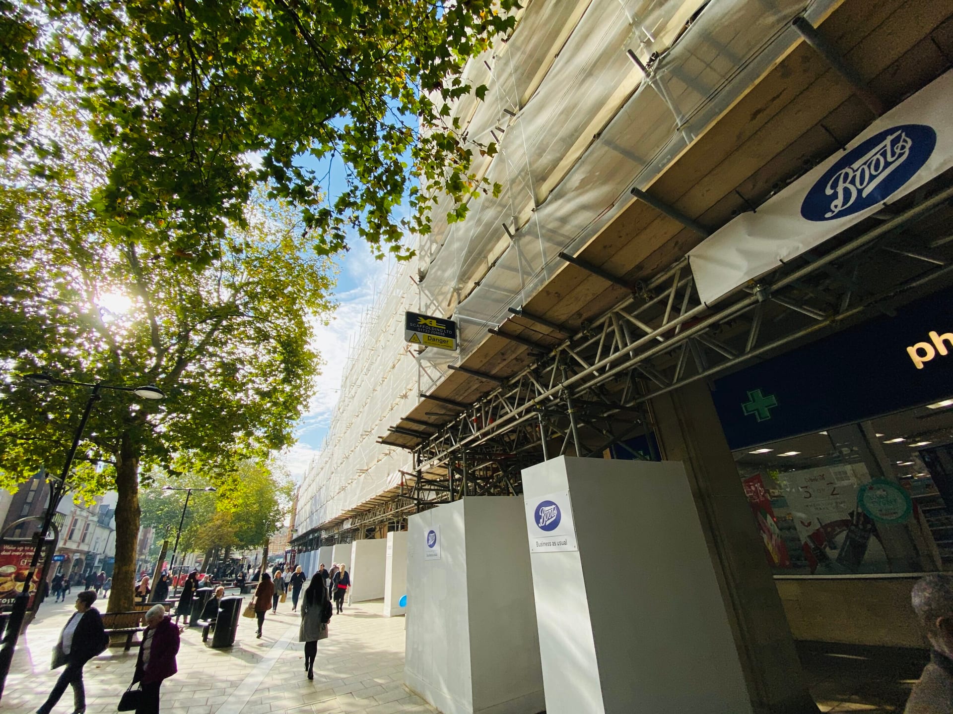 Pavement gantry and scaffold over a row of high street shops
